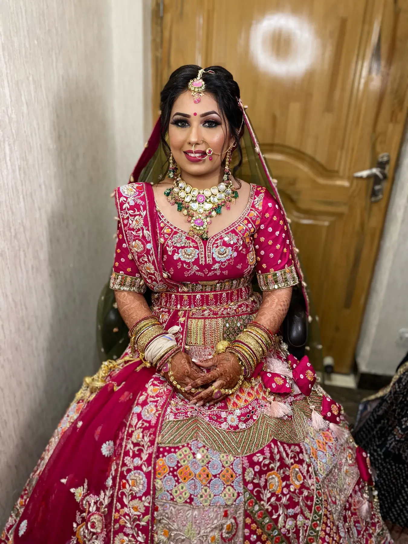 Magenta Lehenga, Statement Earrings. Bridal makeup by Madhu Gupta at MG Makeovers, Gurugram